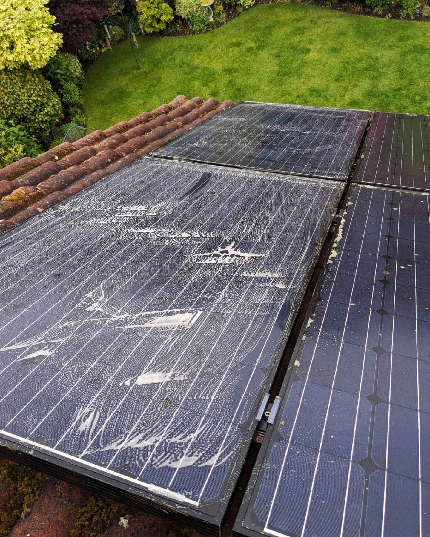Solar panels in the process of getting cleaned